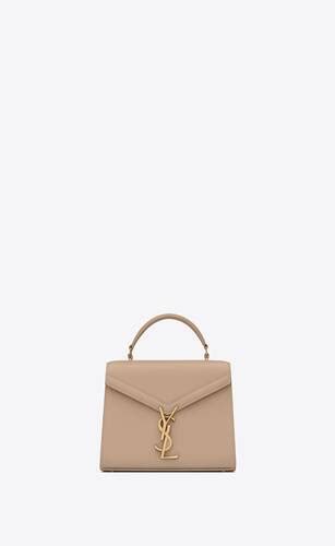 ysl bo mng cassandra|CASSANDRA Mini top handle bag in grain de poudre .